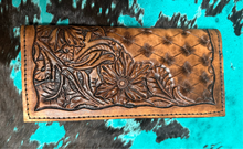 Hand tooled tally book.