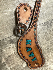 Hand tooled and painted spur straps