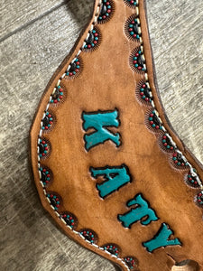 Hand tooled and painted spur straps