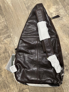 Black and white cowhide bucket sling bag