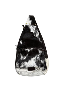 Black and white cowhide bucket sling bag