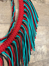 Red, black, and green turquoise fringe breast collar with a wither strap