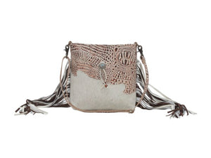 cowhide hand bag with leather strap and fringe